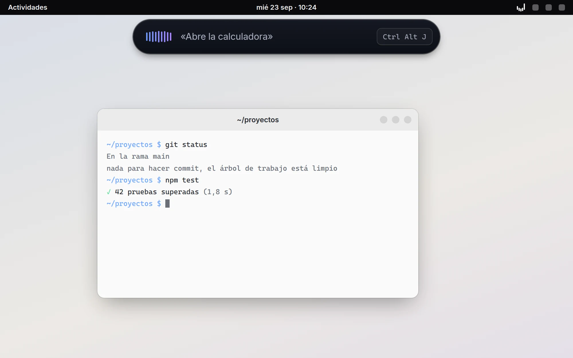 La píldora de Jarvis arriba de un escritorio de ejemplo, escuchando «Abre la calculadora», sobre una terminal abierta.